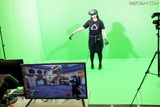 VR体感者と、プレイ中のゲーム画面を合成する新たな試みも披露された。グリーンバックのスペースでVRを体験することで、いま何をプレイしているかが第3者が分かるようになっている