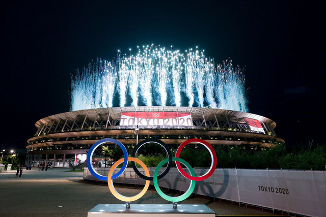 TOKYO, JAPAN - JULY 23: A general view outside the stadium as fireworks are let off during the Opening Ceremony of the Tokyo 2020 Olympic Games at Olympic Stadium on July 23, 2021 in Tokyo, Japan. (Photo by Lintao Zhang/Getty Images)